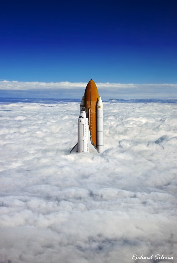 Space Shuttle Over the Clouds